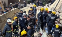 14 قتيلا بعد انتشال آخر جثة من تحت أنقاض البناية المنهارة في الأردن